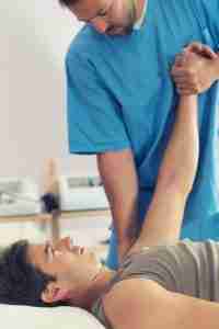 Physiotherapist Working With Patient Arm P4ltmgk