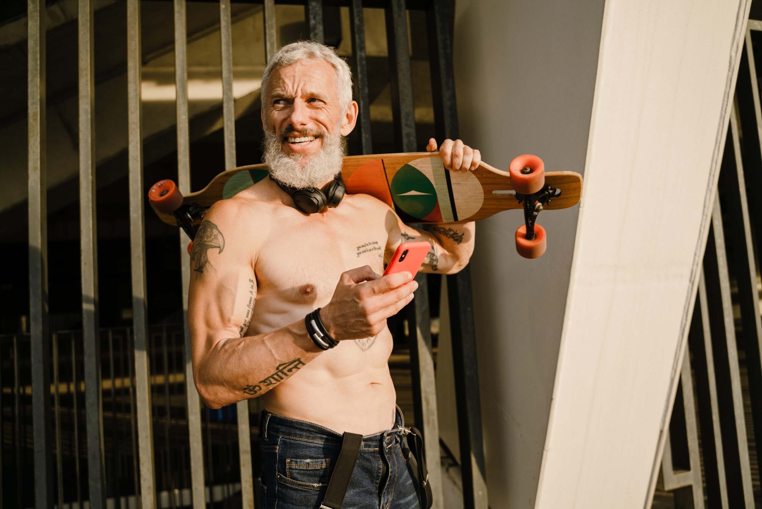 adult shirtless man holding cellphone while standi 2025 02 14 16 02 42 utc scaled